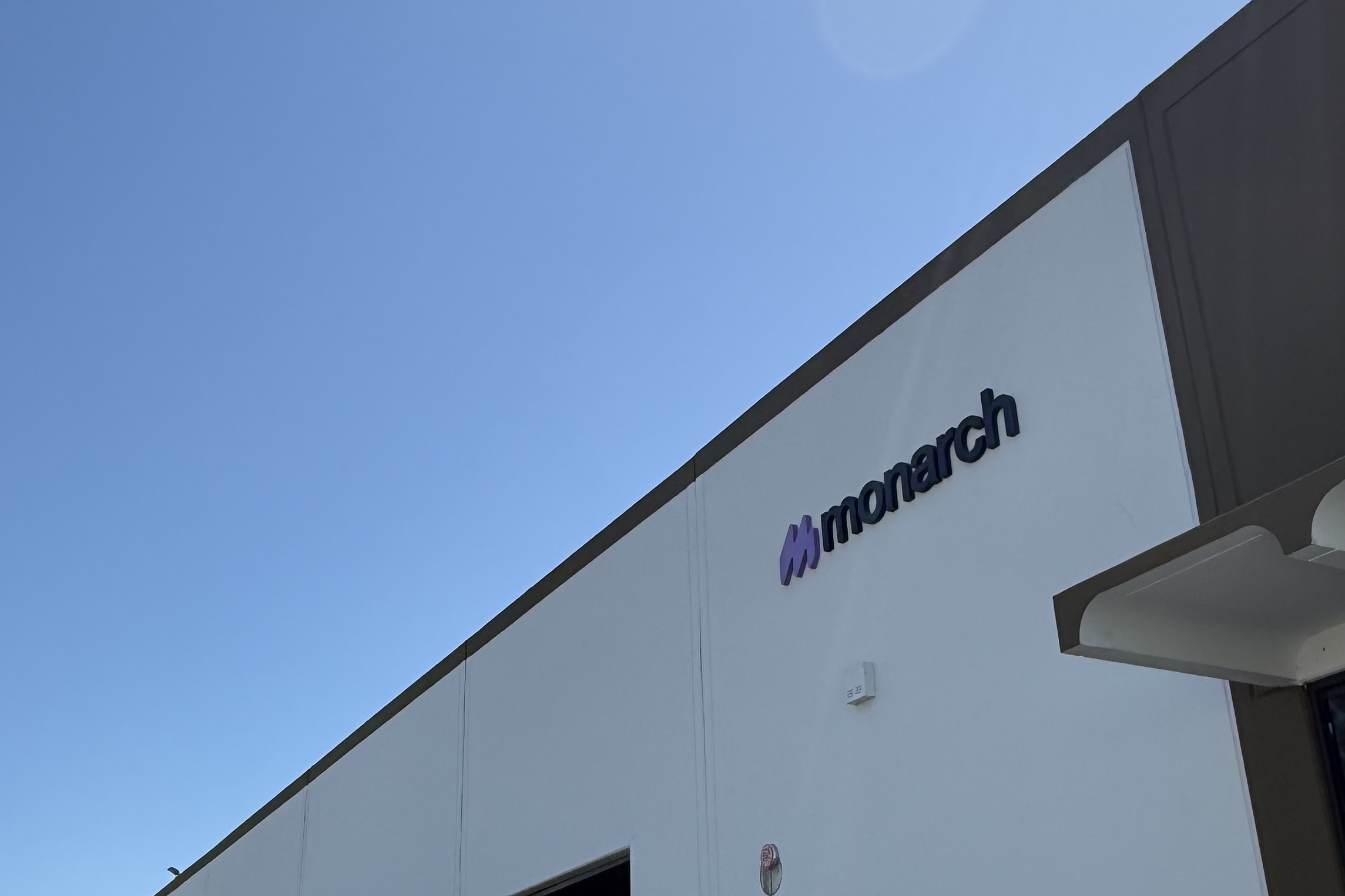 Monarch fulfillment facility exterior in Southern California under a clear blue sky